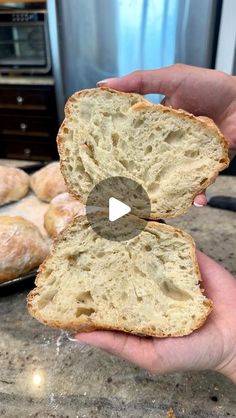 a person holding a piece of bread in their hand with the video showing it to them