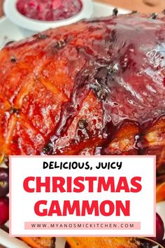 a christmas ham with cranberry sauce on it and the words delicious, juicy christmas gammon