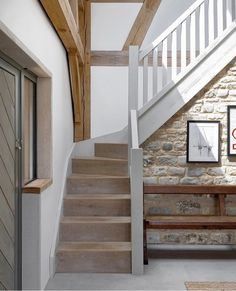 there is a stone wall and stairs in this house