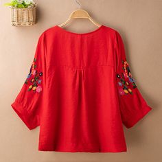 Casual Red Blouse With Floral Embroidery, Red V-neck Blouse With Floral Embroidery, Red Folk Tops With Floral Embroidery, Red Embroidered Folk Blouse, Red Embroidered Shirt For Spring, Red Embroidered V-neck Blouse, Red Long Sleeve Blouse With Floral Embroidery, Red Floral Embroidered Summer Blouse, Red Embroidered Long Sleeve Blouse