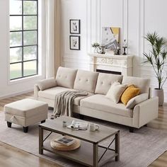 a living room filled with furniture and a fire place next to a wall mounted fireplace