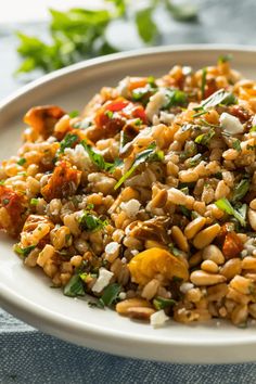 a white plate topped with rice and vegetables