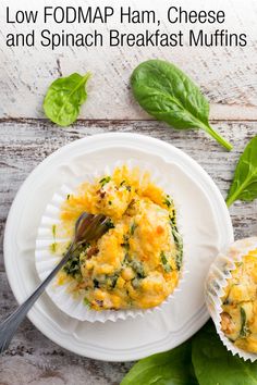 a white plate topped with cheese and spinach muffins