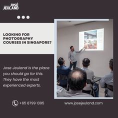 a man standing in front of a projector screen giving a presentation to an audience