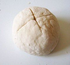 a ball of bread sitting on top of a white counter