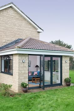 a house with an open patio and sliding glass doors on the front door is shown