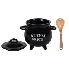 a black witches pot and wooden spoon on a white background with the words, witches broth