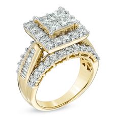 a yellow gold engagement ring set with two princess cut diamonds on the shoulders and sides