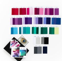 an assortment of color swatches and samples on a white background, including the eye