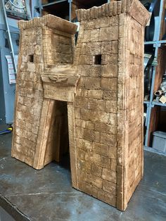 a wooden structure sitting on top of a table