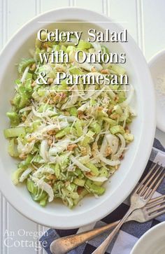 celery salad with onions and parmesan in a white bowl on a table