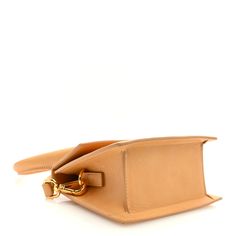 This is an authentic JACQUEMUS Calfskin Le Chiquito Moyen in Light Brown. This stylish petite handbag is beautifully crafted of smooth calfskin leather in brown. It features a leather top handle and an optional shoulder strap. This bag also features the signature logo on the front with gold hardware. The front flap opens to a beige fabric interior with a patch pocket. Le Chiquito Moyen, Stylish Petite, Beige Fabric, Signature Logo, Bag Straps, Leather Top, Gold Hardware, Light Brown, Patch Pocket