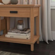 a wooden table with books and vases on it