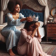 two women sitting on the floor in front of a bed, one holding a tiara