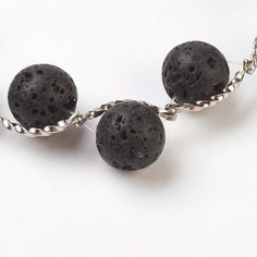 "BRACELET Length: 7 7/8\" Main Stone: Natural Black Lava Beads 8 mm Extended: 50 mm Material: Natural Lava Beads, Brass Findings NECKLACE Length: 20.47'' Main Stone: Natural Black Lava Beads 14-15 mm Extended: 50 mm Material: Natural Lava Beads, Brass Findings, 1mm waxed cotton cord Lava beads are lightweight and comfortable to wear and they bring a natural and easy way to enjoy the benefits of aroma of your favorite essential oil all day long. In addition, Lava Stone is a wonderful aromatherapy Black Beads Lava Stone Jewelry, Black Beaded Lava Stone Jewelry, Essential Oils Diffuser, Organic Perfume, Lava Bead Bracelet, Oil Diffuser Bracelet, Essential Oil Diffuser Bracelet, Diffuser Jewelry, Wooden Bracelet