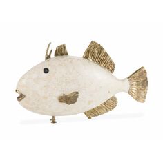 a white and gold fish figurine on a white background