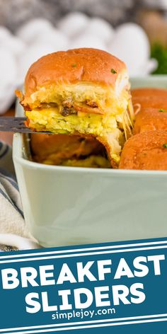 a close up of a sandwich in a bowl with the words breakfast sliders on it