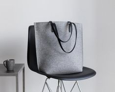 Tote Bag, Felt Bag, Women's Purse, Large Shopper, Merino Wool Felt, Shoulder Bag, Laptop Bag, Woolberry BagElegant and very spacious bag with a zipper and handles made of  leather.This is our most dimensional model. Despite its impressive size, the Long model looks sophisticated and very modern. Her secret is in simplicity of lines and ergonomic shape: side sections visually stretch the silhouette, and the rounded shape of the bottom of the bag looks neat even at maximum filling. In the Long fit Gray Shopping Bag With Adjustable Strap, Gray Large Capacity Bags For Shopping, Gray Bags With Leather Handles For Daily Use, Gray Rectangular Bag For Daily Use, Gray Satchel Bag For Shopping, Gray Tote Bag For Shopping, Gray Tote Shoulder Bag For Shopping, Gray Tote Shoulder Bag, Gray Rectangular Shopping Bag