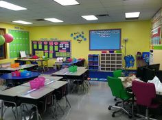 an empty classroom with desks and chairs