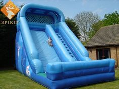 an inflatable water slide is shown on the lawn