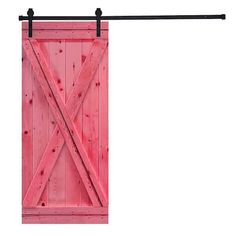 a pink barn door hanging on a black metal bar