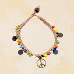 Peace Sign Beaded Hemp Bracelet Colorful and festive, our Peace Sign Beaded Hemp Bracelet features a cobra braid, multi-colored beads, four coins and a peace sign at its center. Find it @ Hippie Shop! #HippieShop #Peace #Hemp #Sustainable #Boho #Hippie Hippie Multicolor Beaded Bracelets, Adjustable Hippie Beaded Bracelets, Hippie Braided Bracelets With Round Beads For Festivals, Multicolor Hippie Braided Bracelets For Festivals, Hippie Beaded Braided Bracelets For Festivals, Casual Festival Braided Bracelets With Colorful Beads, Hippie Multicolor Braided Bracelets With Round Beads, Hippie Style Braided Beaded Bracelets, Hippie Friendship Bracelets With Round Beads