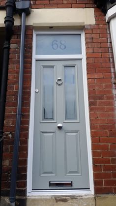 a grey door with the number 66 on it