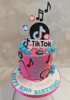 a pink and blue birthday cake with musical notes