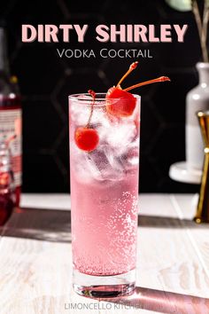 Side view of a pink-colored Dirty Shirley cocktail with maraschino cherries. In the background are a small jar of maraschino cherries along with a bottle of grenadine, a gold colored jigger and a vase with greenery. Above the drink, text reads "Dirty Shirley vodka cocktail". At the bottom, text reads "Limoncello Kitchen". Grenadine Recipe Cocktails, Ladies Night Cocktails, Cute Drinks Alcohol Girls Night, Girls Night Drink Ideas, Cocktails For Women, Pink Whitney Vodka Drinks, Simple Vodka Cocktails, Refreshing Vodka Drinks, Easy Vodka Cocktails