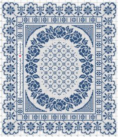 a blue and white cross stitched square with an ornate design on the border,