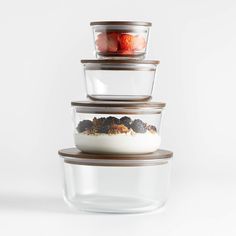 three glass containers stacked on top of each other