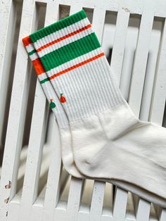 Matchy- mismatchy is the new matchy-matchy. Our collection of mismatched vintage stripe crew socks is fun and bold. Each pair is accented by a flower design to symbolize the beauty of mismatch fashion. Thinner and lighter than our other vintage stripe crew sock designs, it will compliment any shoe type and offer a streamlined look with any athletic wear. Available in 3 different colors. Playful White Socks For Spring, Retro Multicolor Cotton Socks, Sporty Multicolor Cotton Socks, Sporty Green Socks For Spring, White Cotton Retro Socks, Retro White Cotton Socks, Trendy Striped Socks For Spring, Trendy Green Cotton Socks, Casual Striped Socks For Spring