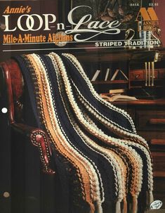 the cover of lop n lace magazine shows a chair with a crocheted blanket on it