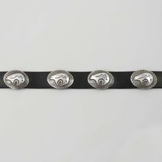 Navajo Sterling Silver Concho Belt with Overlaid Bear with Heartline Designs. This Concho Belt Features a Buckle as well as 14 Oval Conchos on 1” Wide Black Leather.Buckle Dimensions: 2” x 1.5”Concho Dimensions: 1.5” x 1.125”Belt Length: 41” Maximum Length (holes punched at 35” - 38”) Concho Belt, Belt Length, Leather Buckle, Hole Punch, Black Leather, Buckle, Sterling Silver, Silver, Leather