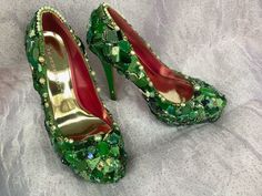 two pairs of green and red high heeled shoes