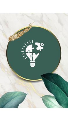 a green and gold circle with a lightbulb on it, surrounded by leaves