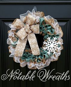 a snowflake wreath on the front door of a house