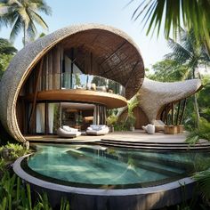 an artisticly designed house in the middle of some tropical trees and plants, with a swimming pool