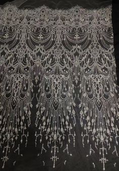 We offer a variety of fashion handmade fabric，those are widely use for wedding dress，garment and fashion cloth. we sell it by yard，our minimum order is 1 yards，and we always package it 15 yards for one roll，the width is 125cm/48inch Material ： sequins ,peals ,mesh ，Rayon,polyester. Symmetrical embroidery floral pattern, with lovely flowers in the middle, scalloped border. You can also cut and use separately. Perfect for dress, tops, wedding veil. You can split the piece up and have one scalloped Elegant Tulle Lace Fabric With Rhinestones, Elegant Beaded Lace Sequin Fabric, Beaded Lace Sequin Fabric For Banquet, Wedding Dress Fabric, Scalloped Border, Beaded Lace Fabric, Fashion Beads, Dress Tops, Wedding Dress Fabrics