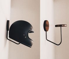 the helmet is hanging on the wall next to the scooter's head