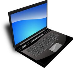 an open laptop computer sitting on top of a black mat with a mouse and keyboard