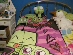 a child's bed with two stuffed animals on it