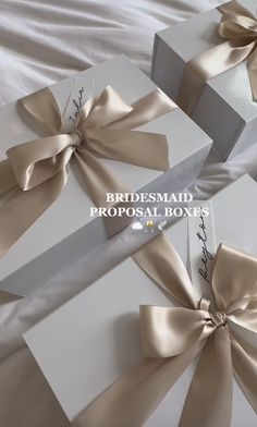 three white boxes wrapped in satin ribbons with the words bridesmaid proposal boxes