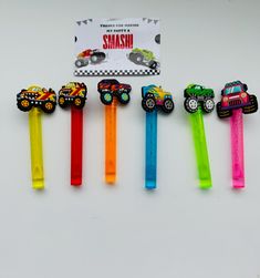 five different colored toothbrushes with cars on them and a card for the same person