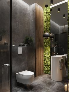 a modern bathroom with moss growing on the wall and toilet in the corner, along with a sink