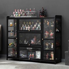 a display case filled with action figures and figurines