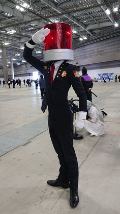 a man dressed in an air force uniform with a red light on his head and arms