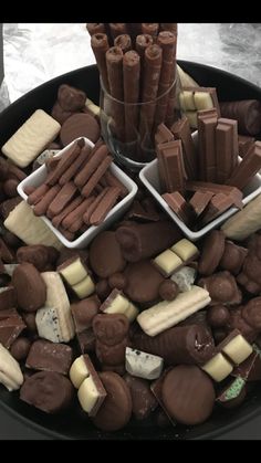 chocolates and marshmallows are arranged in trays