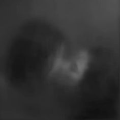 a blurry image of a person's face in black and white, with one eye partially obscured by the fog