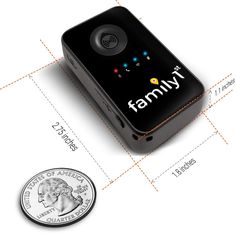 an electronic device with the words family written on it next to a quarter dollar coin